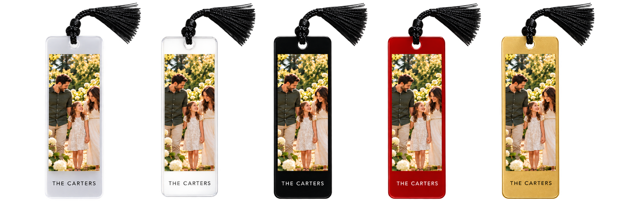 Digital mockup. Five family-photo bookmark mockups in frosted, clear, black, red and gold finishes with black tassels. Current purchase option: frosted acrylic with black tassel.