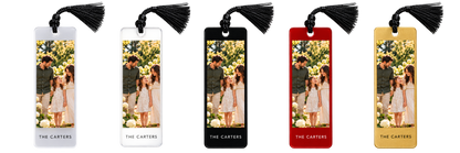 Digital mockup. Five family-photo bookmark mockups in frosted, clear, black, red and gold finishes with black tassels. Current purchase option: frosted acrylic with black tassel.
