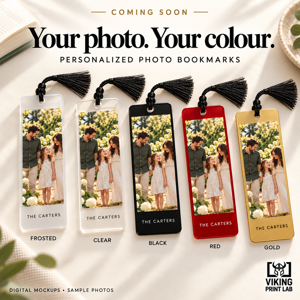 Digital mockup. Coming-soon promotional mockup showing family-photo bookmarks in frosted, clear, black, red and gold finishes. Current purchase option: frosted acrylic with black tassel.