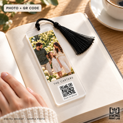 Digital mockup of the Moment Marks Photo + QR Code upgrade: frosted family-photo bookmark with a visible printed QR code, black tassel and Scan to Relive caption. QR symbol is illustrative.