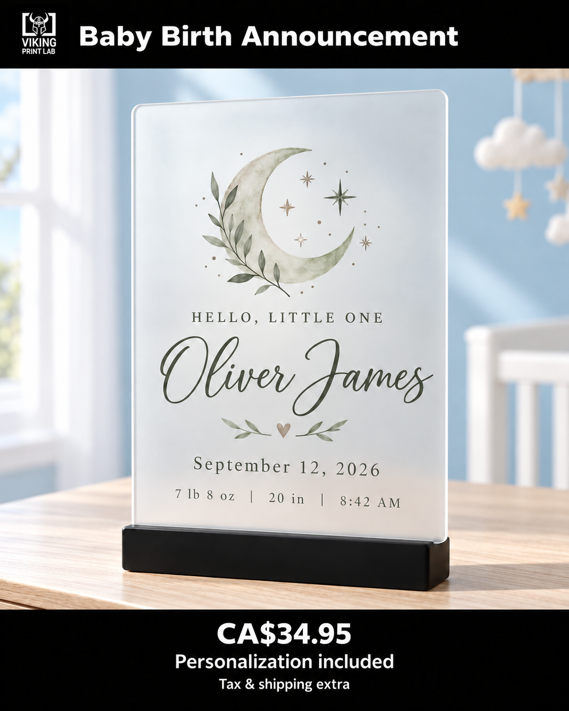 Personalized frosted acrylic baby birth announcement featuring Oliver James, displayed on a black stand in a blue nursery.