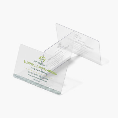 Clear plastic business cards with a landscaping design example.