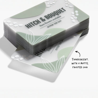 Frosted plastic business card stack showing the semi-transparent material and a design example.