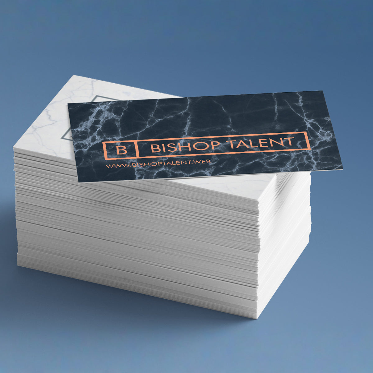 Premium Plus business card stack with an example printed design.