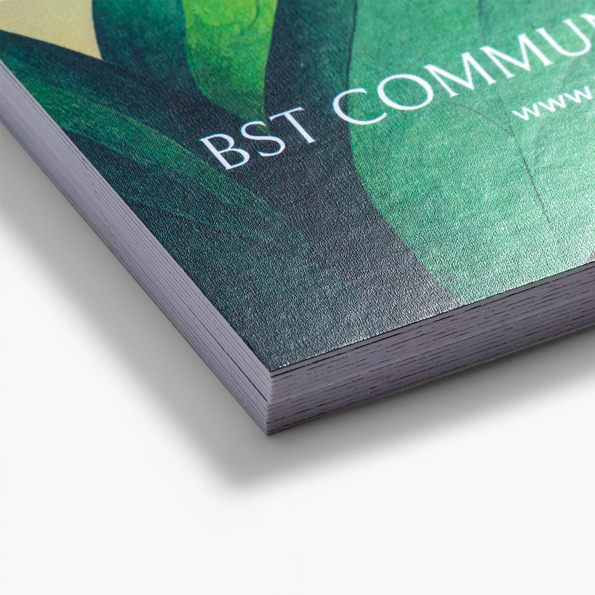 Close-up of Premium Plus business card paper with a printed design example.