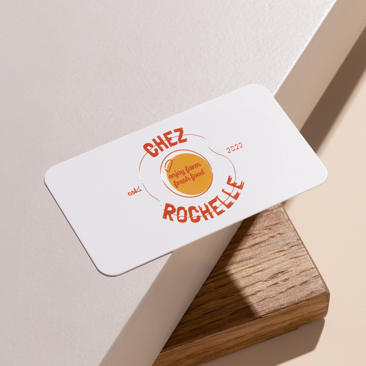 Rounded-corner business card example with raised clear gloss on the front.