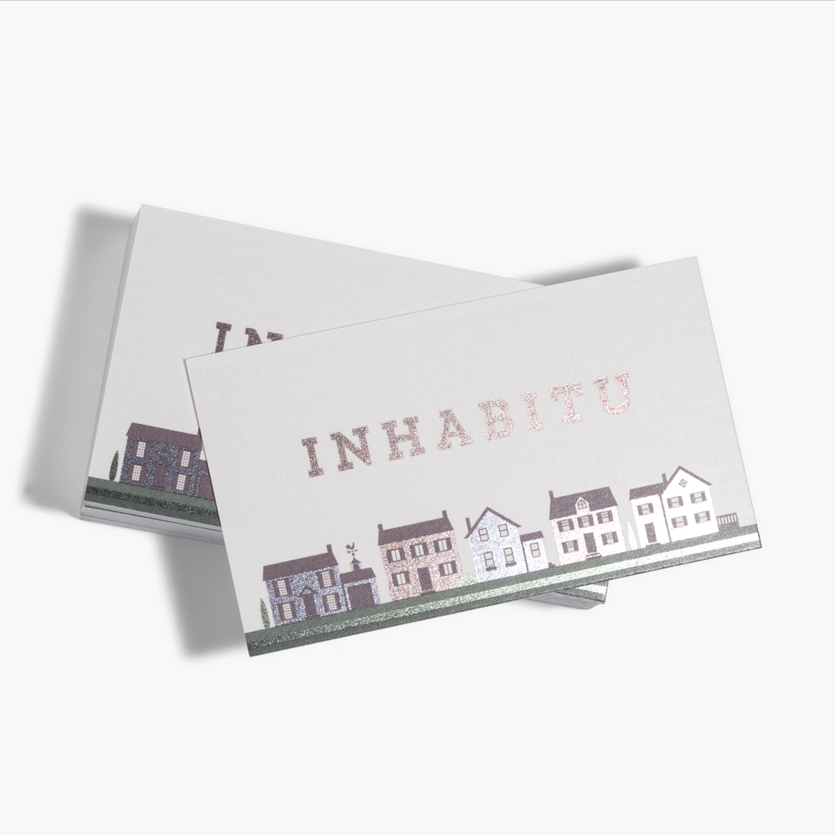 Metallic foil accent business card examples for a real-estate business.