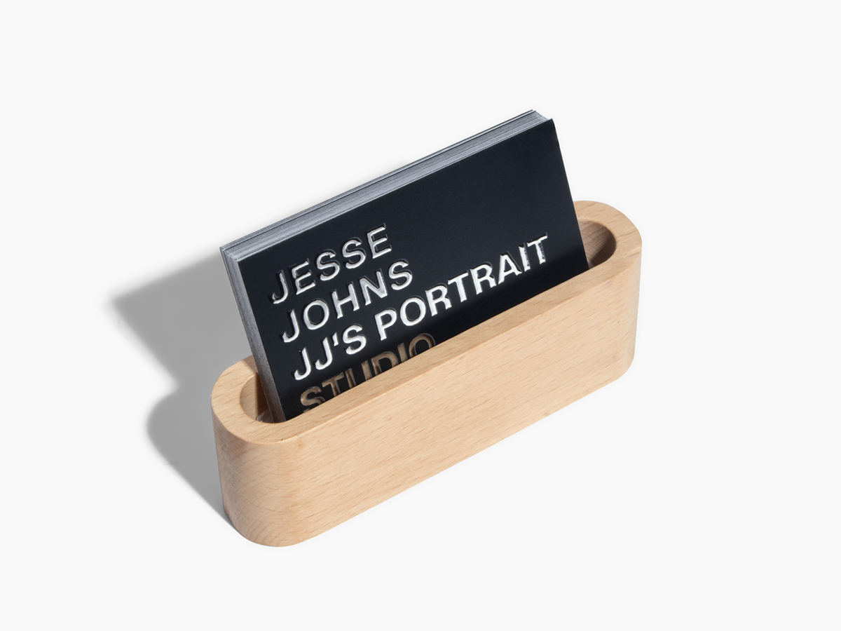 Silver raised foil portrait-studio business card example;not a glitter finish example.