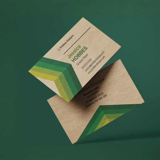 Example kraft business cards showing printed designs on natural brown stock.