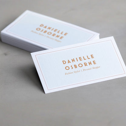 Example white linen business cards with a simple border design.