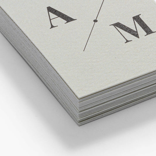 Close-up of the lightly rippled surface of natural textured business cards.