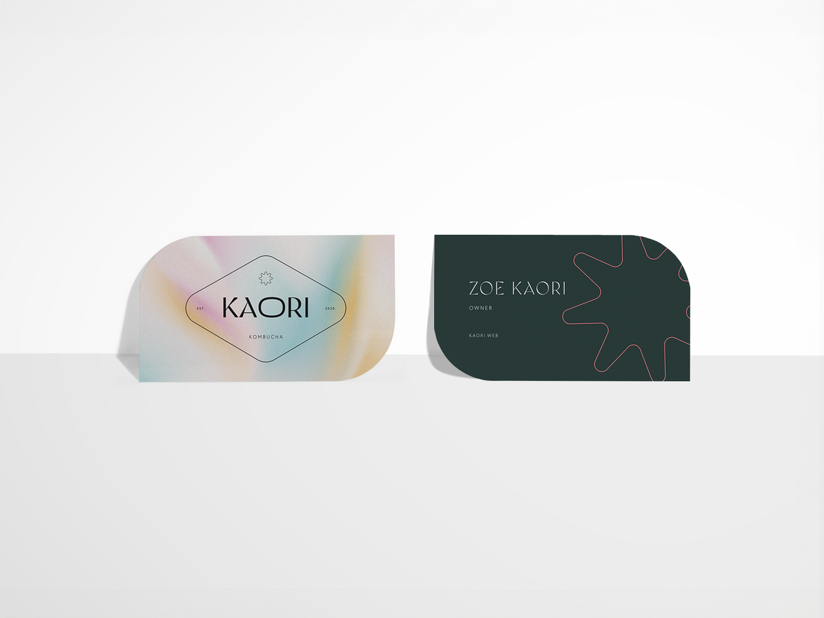 Leaf-shaped business cards showing front and back sample artwork