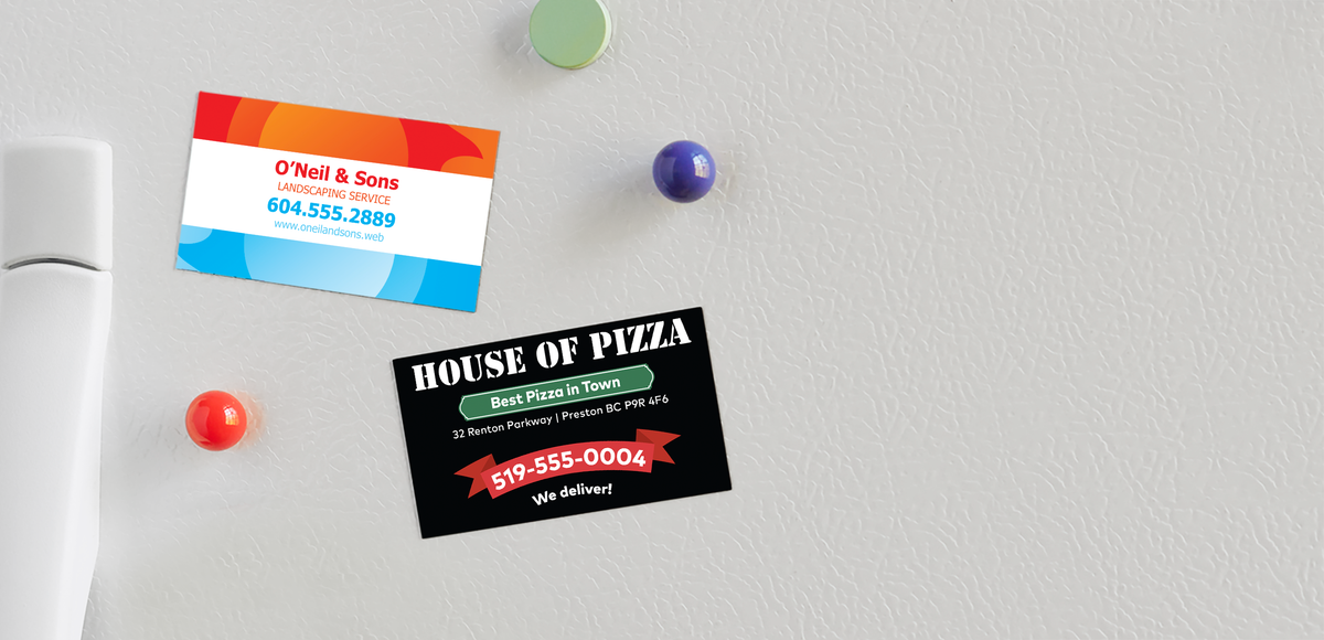 Magnetic business cards displayed on a refrigerator