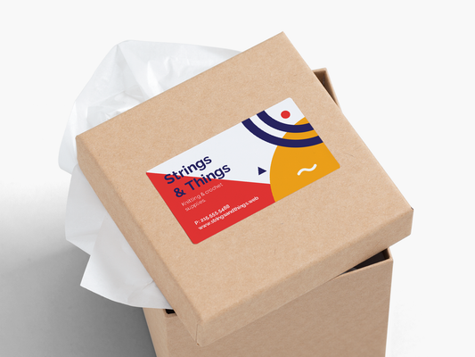 Business card sticker applied to a kraft package