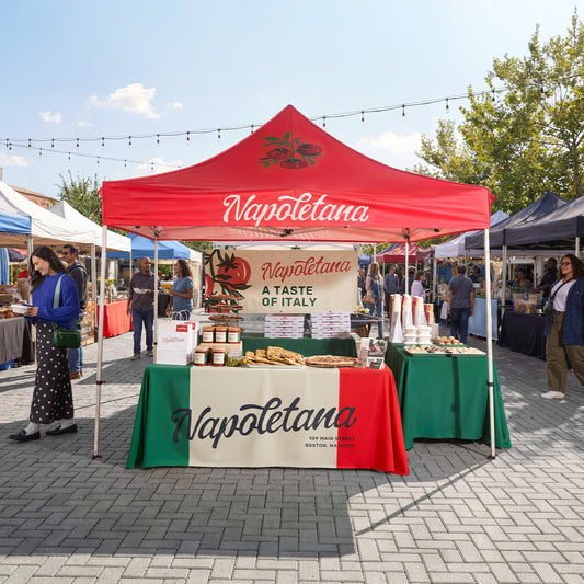Custom printed canopy tent outdoors — optional walls and table accessories shown