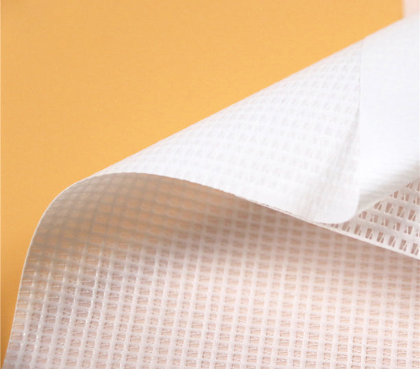 Detail of open-weave polyester mesh banner material