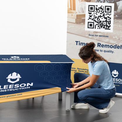 Fitting a custom stretch table cover over a folding table