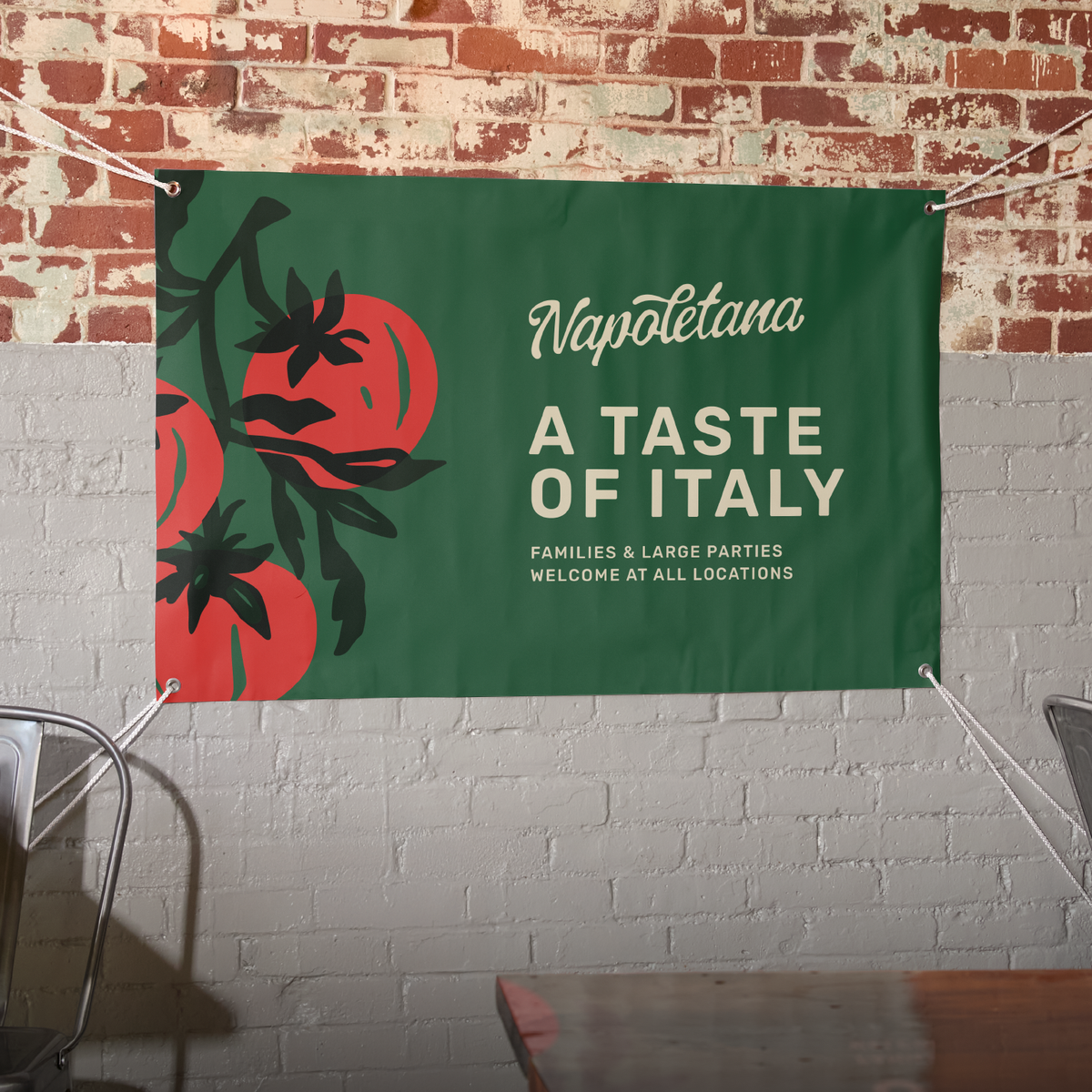 Illustrative custom vinyl banner displayed on a brick wall