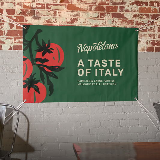 Illustrative custom vinyl banner displayed on a brick wall