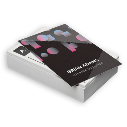 Sample high-gloss business cards with colourful artwork on dark card layouts.