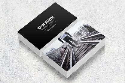 Sample laminated business cards showing a photography design on both sides.