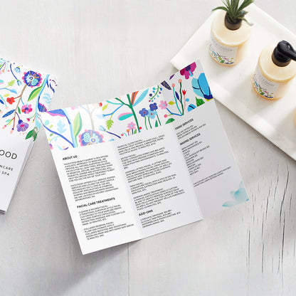 Example open trifold brochure showing three interior panels and a floral design.